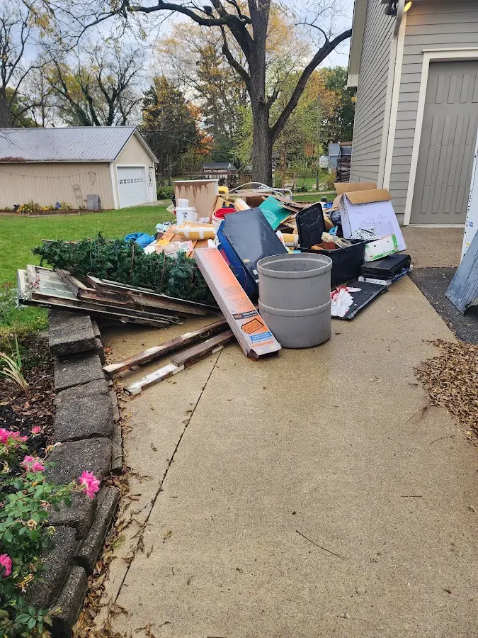 Dumpster being loaded with debris for 30 Yard Dumpster Rental in Timonium